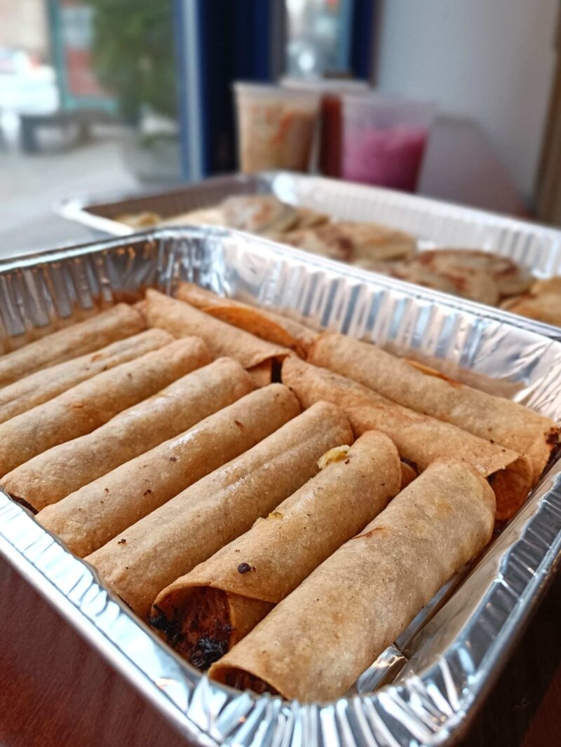 Guatemalan taquito tray contains taquitos filled with veggies, meat or cheese.