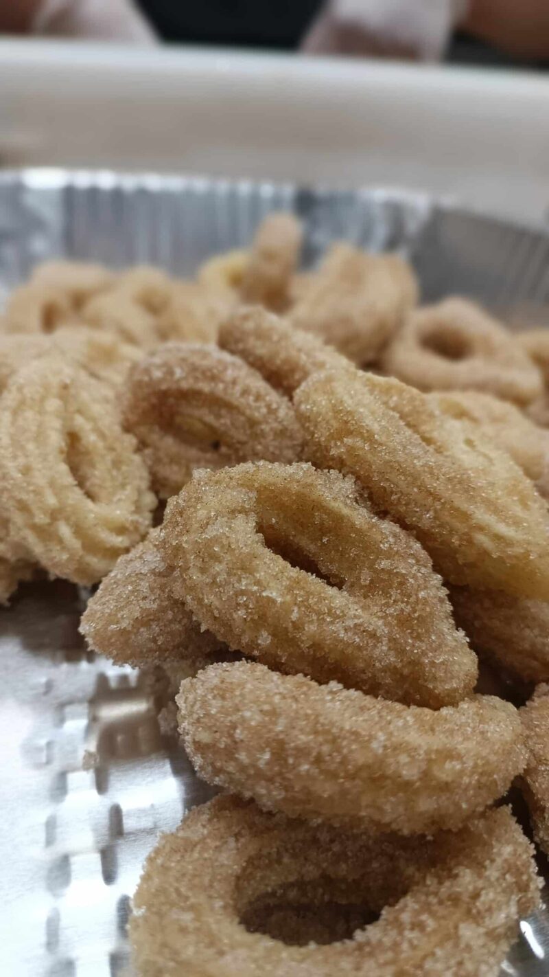 A tray of original crispy cinnamon sugar mini churro loops.