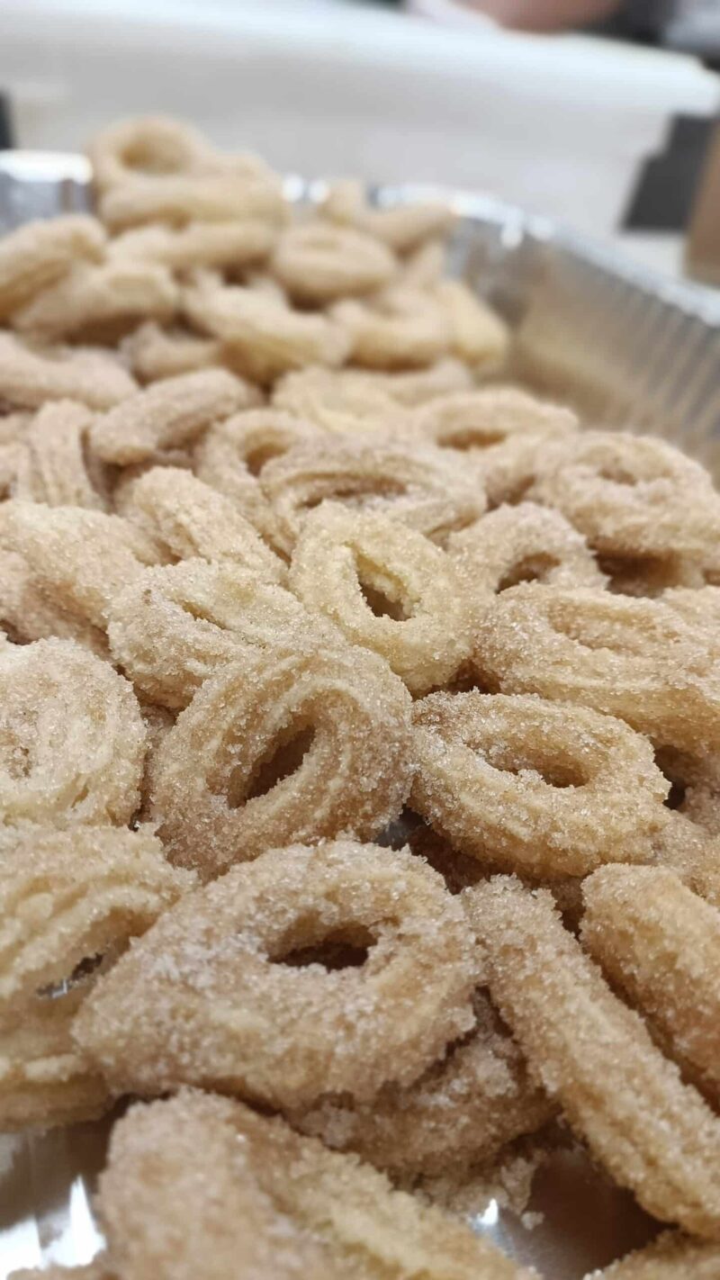 A tray of original churros, crispy cinnamon sugar mini churro loops.