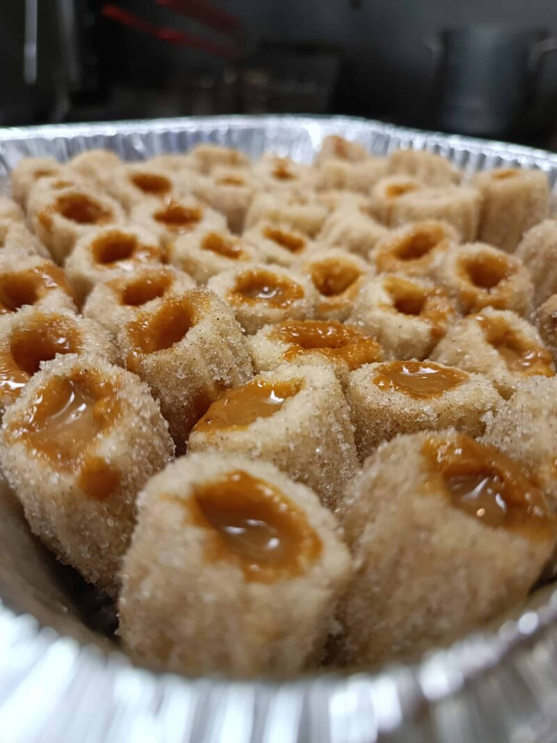 Tray of Filled Churros with cinnamon sugar and filled with your choice of dulce de leche, dark chocolate or coffee cream.