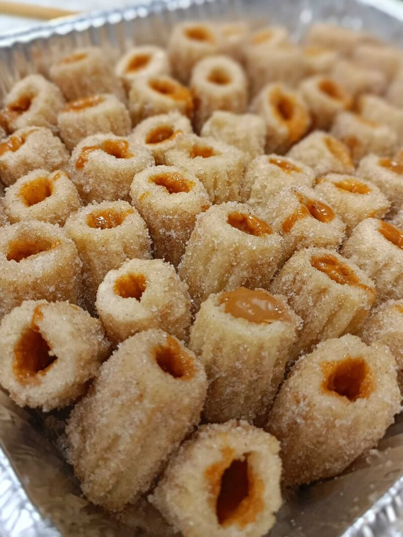 Tray of Filled Churros with cinnamon sugar and filled with your choice of dulce de leche, dark chocolate or coffee cream.