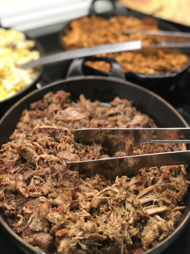 Tray of Pork mechada, with tomato, black pepper & spices.