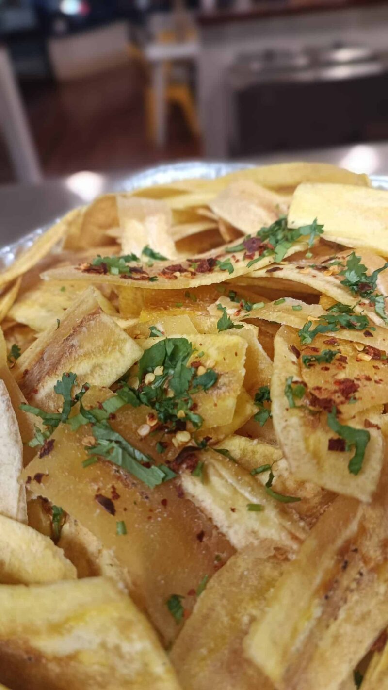 El Merkury's plantain chips tray: spicy, herby, and cheesy goodness in a single bite.