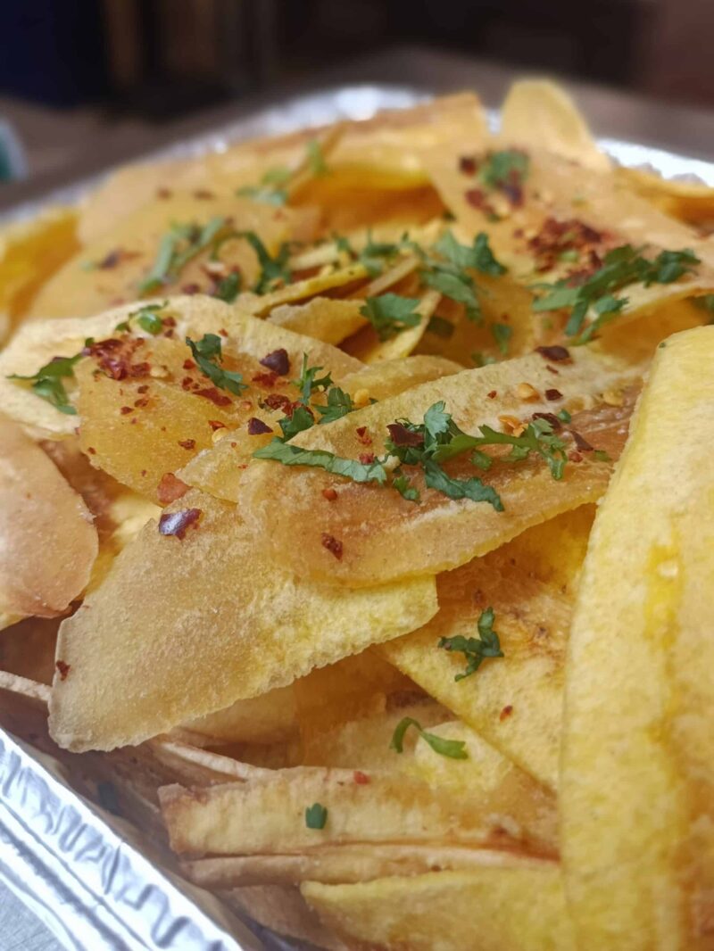 Thick cut plantains chips, fried until crispy and topped with sea salt, chili flakes and cilantro.