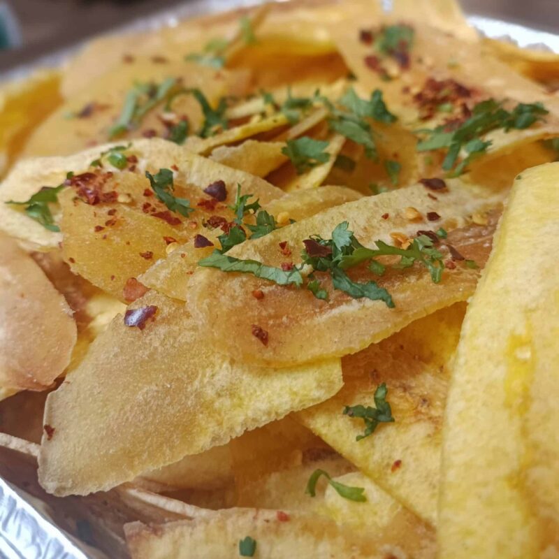 Thick cut plantains chips, fried until crispy and topped with sea salt, chili flakes and cilantro.
