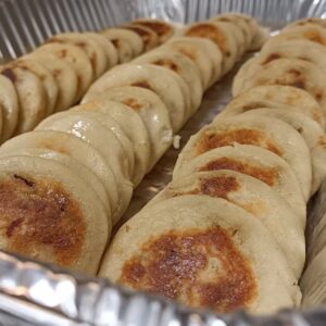 Mini Pupusas in the jalapeno black bean flavor. Pupusas arre corn dough pockets filled with protein and its served with salsa, curtido and pickled red onions.