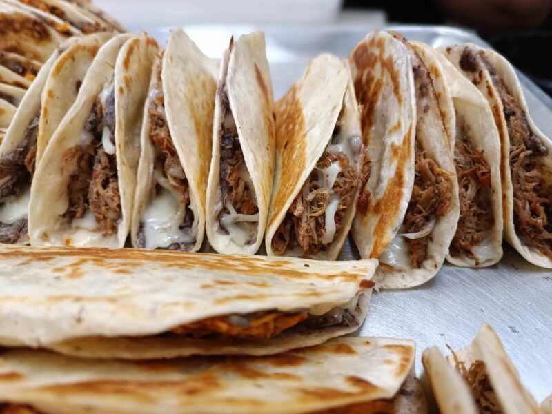 Savory and tasty baleadas tray, house made tortilla with beans, cheese, avocado and protein.