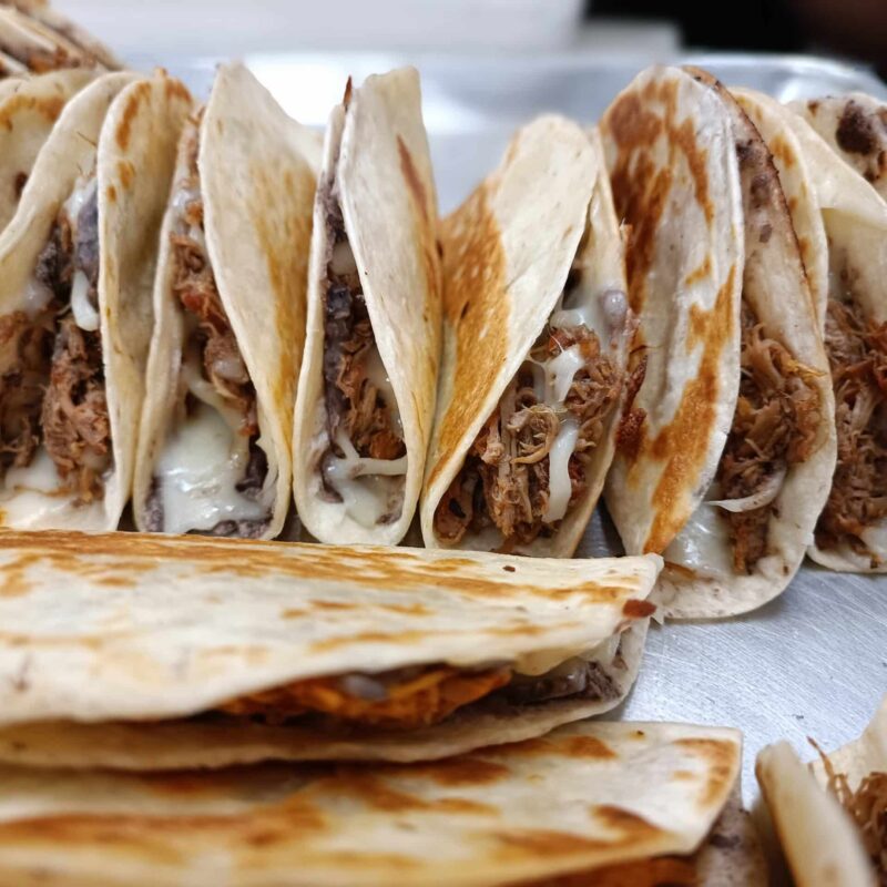 Savory and tasty baleadas tray, house made tortilla with beans, cheese, avocado and protein.