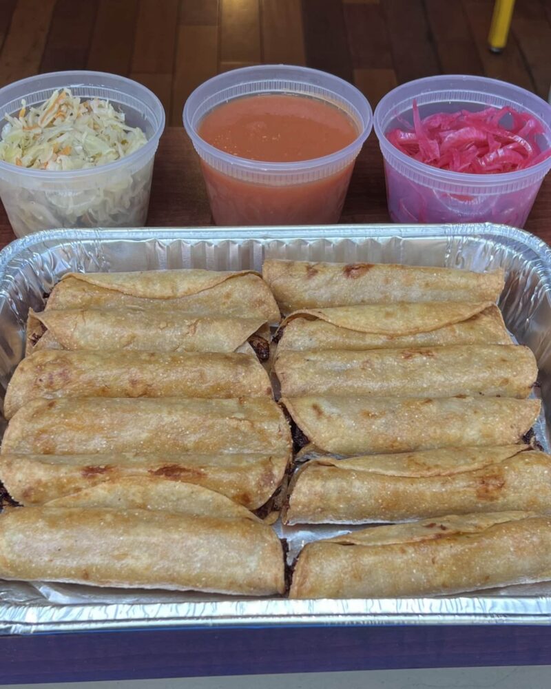 Tray of savoury taquitos with your choice of filling, salsa, curtido slaw and pickled onions. Perfect taquitos game day package version!